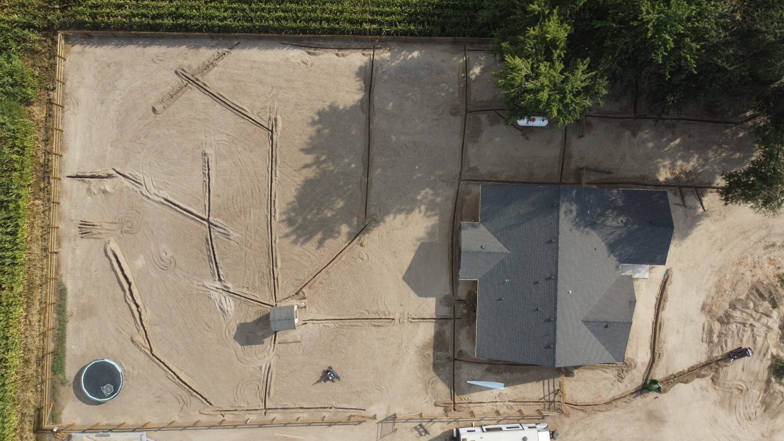 Top down drone view of residential property with irrigation ditches